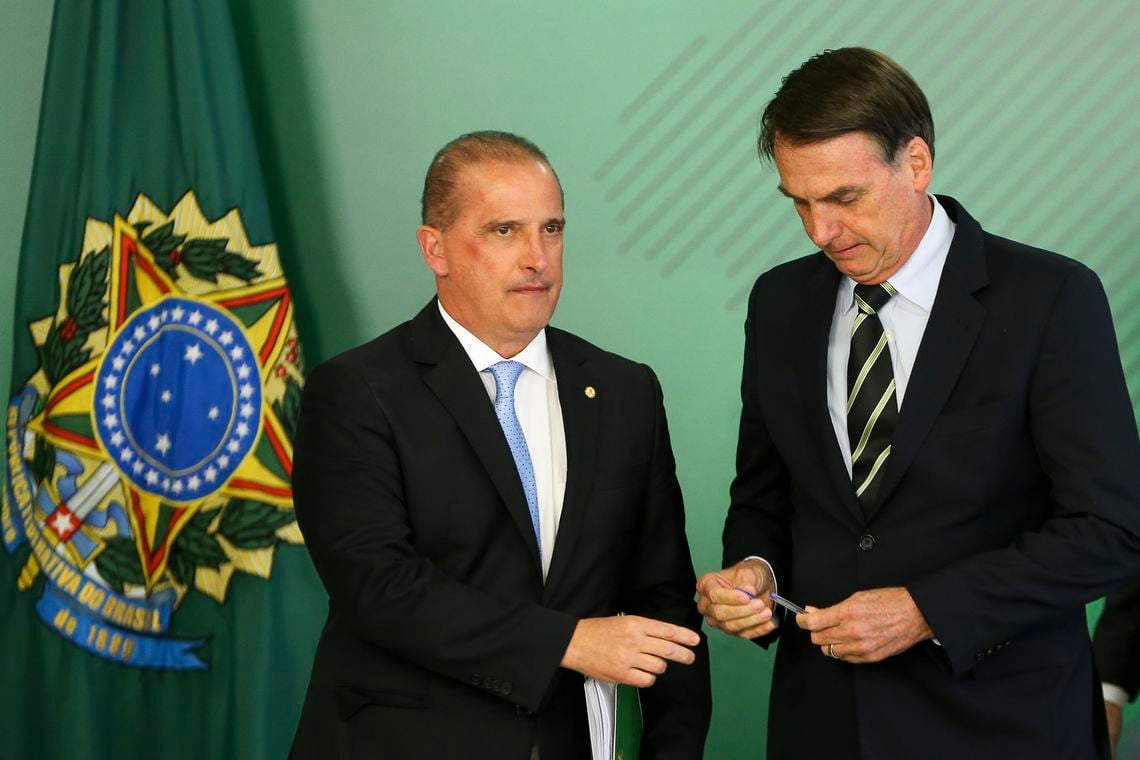 Jair Bolsonaro e Onyx Lorenzoni, durante cerimônia de sanção de lei que fez minireforma eleitoral [fotografo]Marcelo Camargo/ABr[/fotografo]