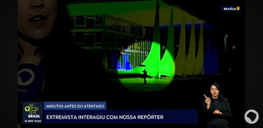 Francisco Wanderley Luiz aparece ao fundo da imagem, após interagir com a repórter Manuela Castro. Foto: Reprodução/TV Brasil