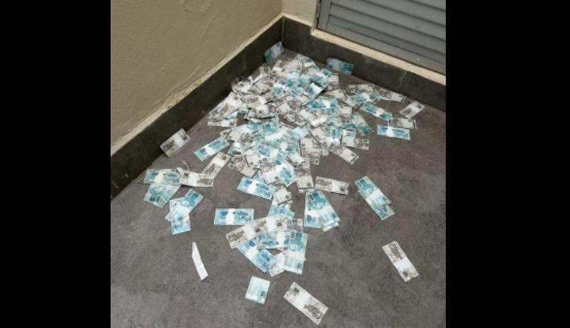 Dinheiro foi arremessado pela janela com a chegada da Polícia Federla